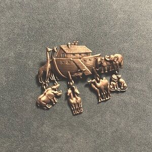 Noah’s Ark pin-Silver. It is about 3.5 inches long.